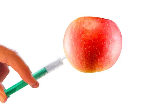 concept; Apple with vitamin Syringe isolated on white