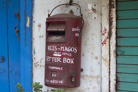 Traditional red old Indian mailbox. India Goa.