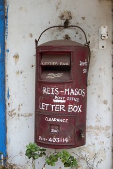 Traditional red old Indian mailbox. India Goa.