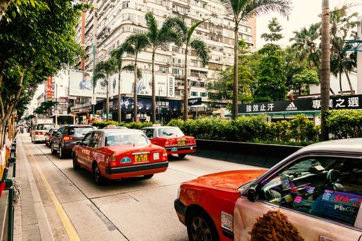 Traffic of Red Taxi on the street of Nathan Road, Hong kong, China, 20 june, 2013