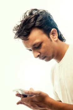 Young Indian businessman using mobile phone