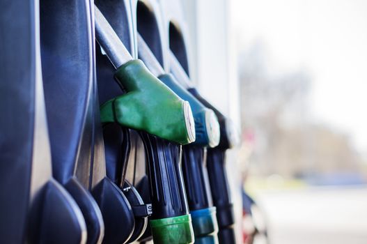 Pump nozzles at the gas station. For your commercial and editorial use.