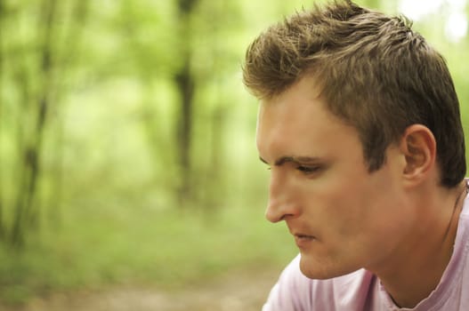 Thoughtful young man Outdoors. For your commercial and editorial use.