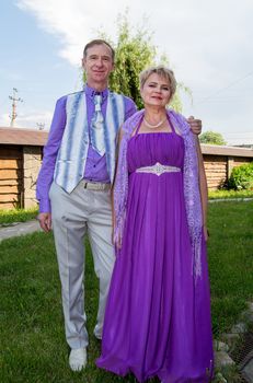 Successful and happy man and woman couple in smart clothes.