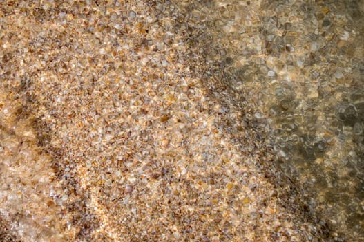 Pebbles, corals and sand under water. For your commercial and editorial use.
