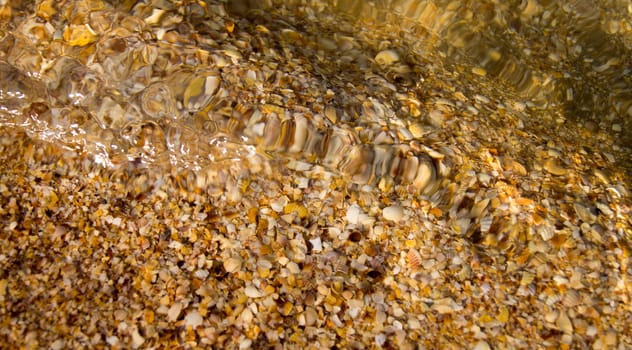 Pebbles, corals and sand under water. For your commercial and editorial use.