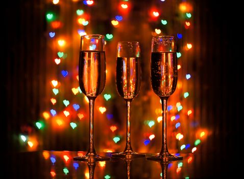 A glass of champagne on the background bokeh. For your commercial and editorial use.