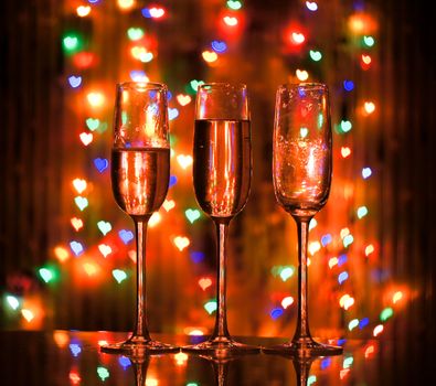 A glass of champagne on the background bokeh. For your commercial and editorial use.