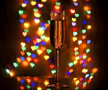 A glass of champagne on the background bokeh. For your commercial and editorial use.