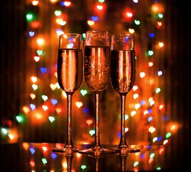 A glass of champagne on the background bokeh. For your commercial and editorial use.