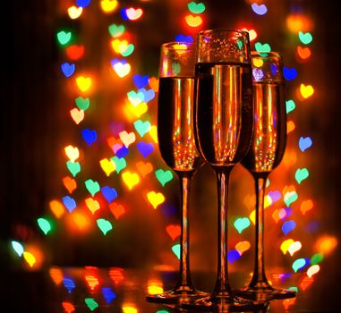 A glass of champagne on the background bokeh. For your commercial and editorial use.