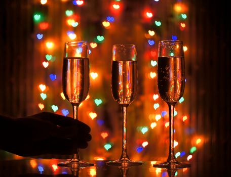 A glass of champagne on the background bokeh. For your commercial and editorial use.