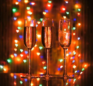 A glass of champagne on the background bokeh. For your commercial and editorial use.