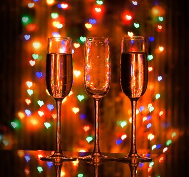 A glass of champagne on the background bokeh. For your commercial and editorial use.