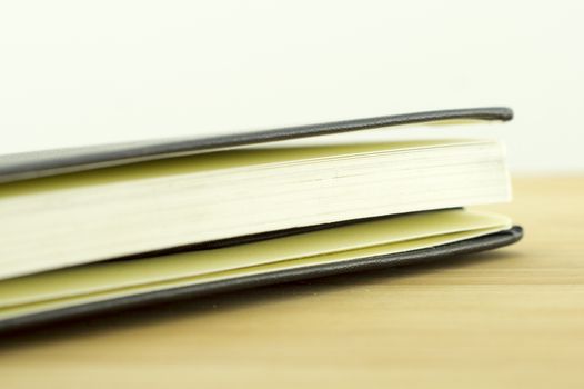 open book with the incident light from the side on desk.