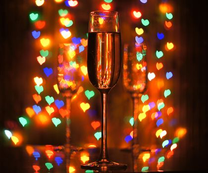 A glass of champagne on the background bokeh. For your commercial and editorial use.