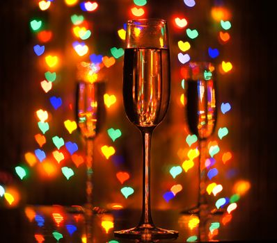 A glass of champagne on the background bokeh. For your commercial and editorial use.