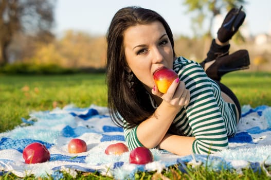 beautiful and sexy girl sitting on bench outdoors. 