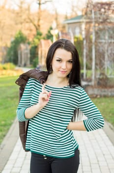 beautiful and sexy girl sitting on bench outdoors. 