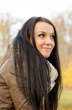 beautiful and sexy girl sitting on bench outdoors. 