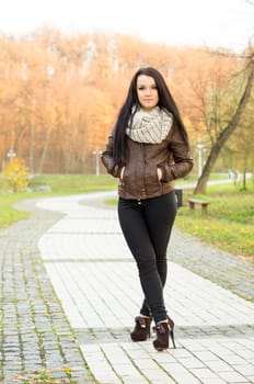 beautiful and sexy girl sitting on bench outdoors. 