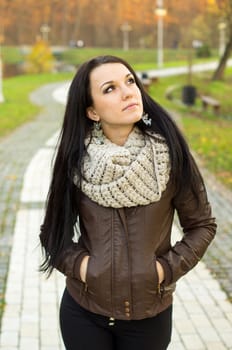 beautiful and sexy girl sitting on bench outdoors. 