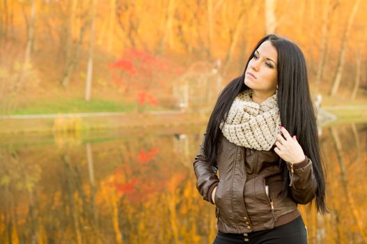 beautiful and sexy girl sitting on bench outdoors. 