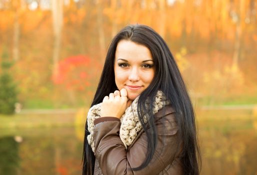 beautiful and sexy girl sitting on bench outdoors. 