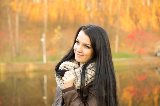 beautiful and sexy girl sitting on bench outdoors. 