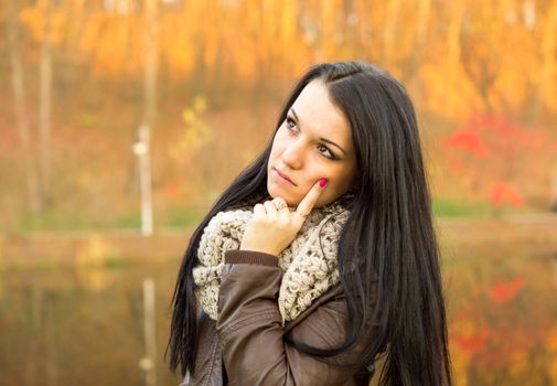 beautiful and sexy girl sitting on bench outdoors. 