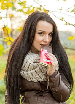 beautiful and sexy girl sitting on bench outdoors. 