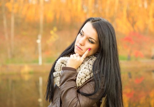 beautiful and sexy girl sitting on bench outdoors. 