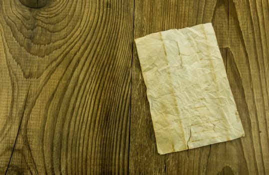 old paper on wood background. For your commercial and editorial use