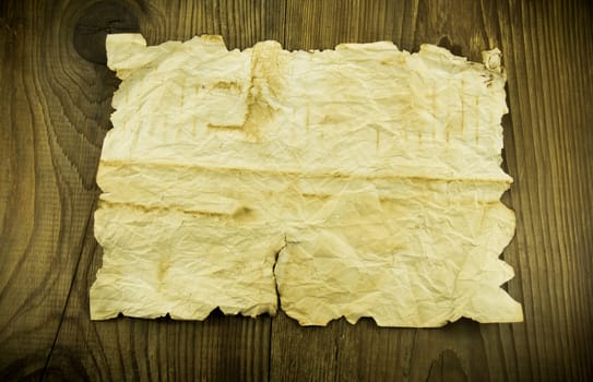 old paper on wood background. For your commercial and editorial use