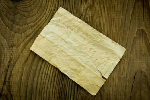 old paper on wood background. For your commercial and editorial use