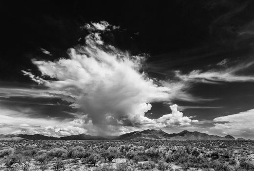 Black and white dramatic monsoon clouds over mountains