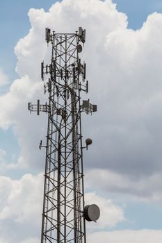 Cellular telephone repeaters on tall tower in sky