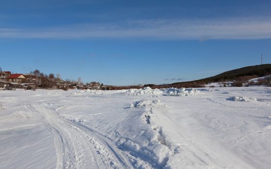 River under the snow and ice. Russia. Kandalaksha Bay of the White Sea.