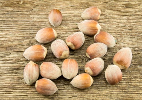 Filberts on a wooden table. Close-up shot. For your commercial and editorial use.