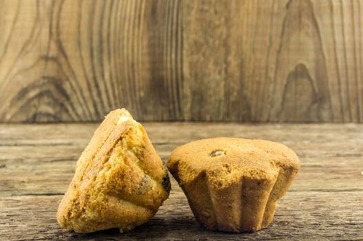 Tasty cupcake on wooden table. For your commercial and editorial use.