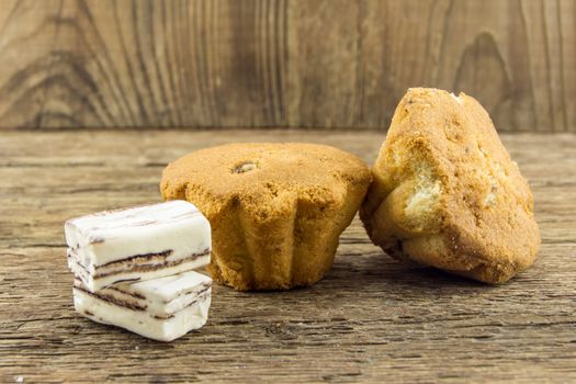 Tasty cupcake on wooden table. For your commercial and editorial use.