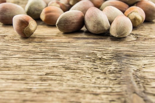 Filberts on a wooden table. Close-up shot. For your commercial and editorial use.