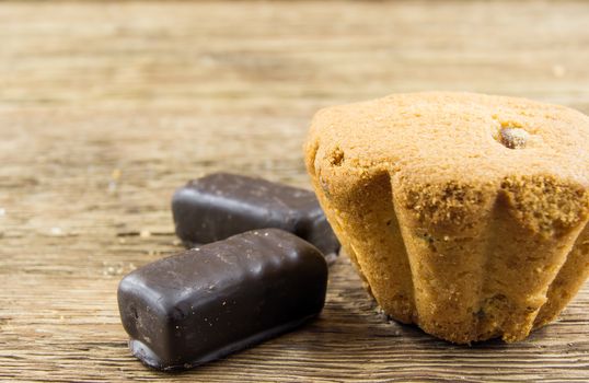 Tasty cupcake on wooden table. For your commercial and editorial use.