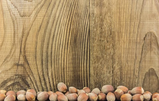 Filberts on a wooden table. Close-up shot. For your commercial and editorial use.