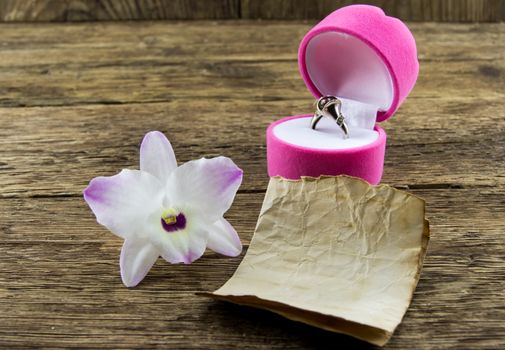 orchid flower on wooden background with space for inscriptions