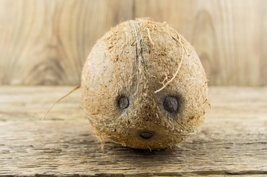 coconut and lie on a wooden background.