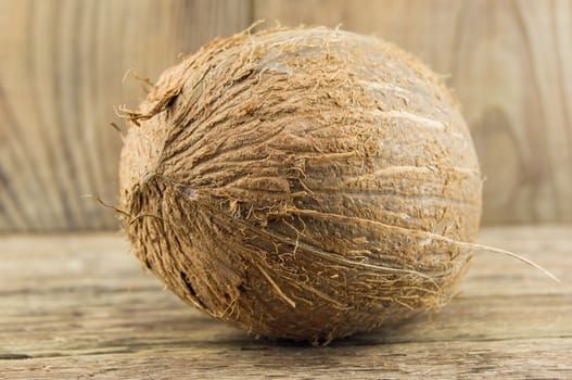 coconut and lie on a wooden background.