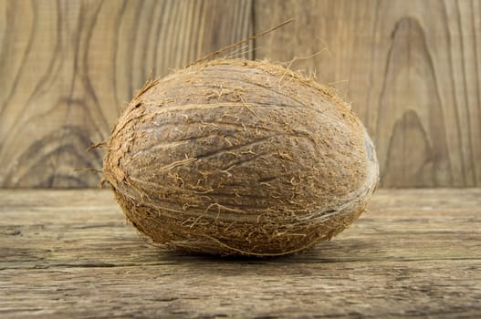 coconut and lie on a wooden background.