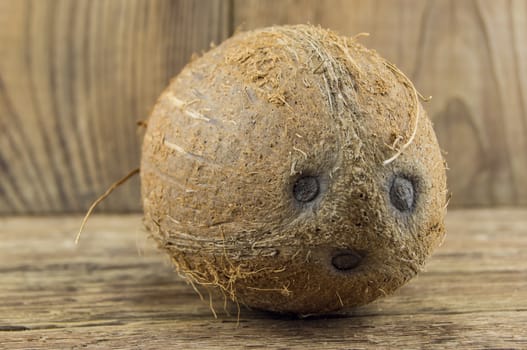 coconut and lie on a wooden background.