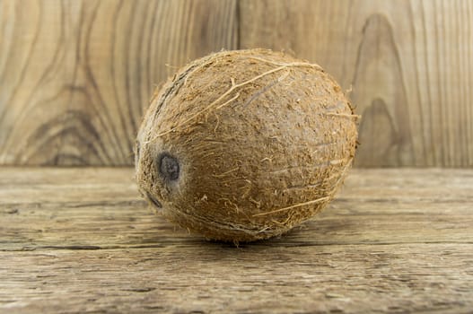 coconut and lie on a wooden background.